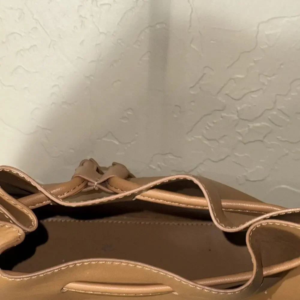 J. Crew drawstring bucket bag vegan leather in camel brown.